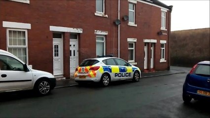 Police outside house where baby was found injured