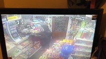 CCTV shows the moment shopkeeper is attacked by armed robbers