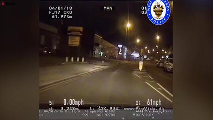 SWNS - Heart-stopping footage shows man at cashpoint avoiding death by centimetres after 100mph drug driver crashes into wall
