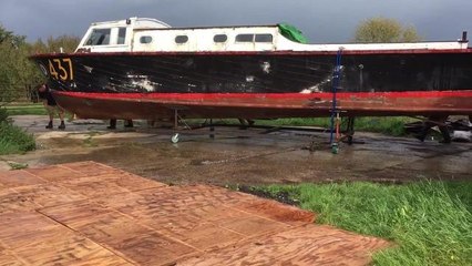 The amateur boat builders move their new project to its new home
