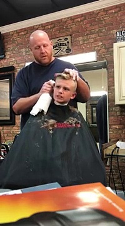 Barber pranks kid by pretending he's cut his ear off