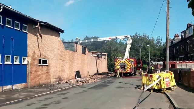 Firefighters at the scene of the blaze at Jewson in Moor Road