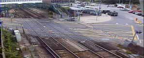 Motorist smashes into level crossing barriers