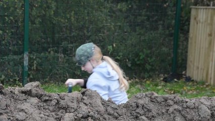 Schoolchildren dig their own trench to learn about warfare during the First World War
