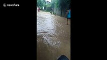 Storm Falcon leaves flooded streets behind after exiting the Philippines