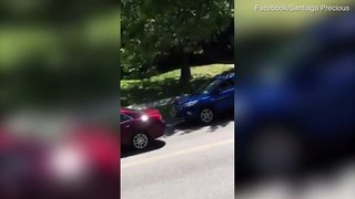 White man pulls a gun on muslim woman over traffic accident