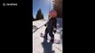 Three-year-old snowboarder takes on the slopes