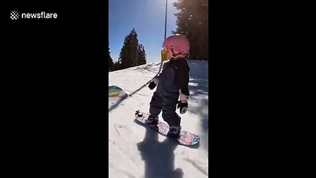 Three-year-old snowboarder takes on the slopes