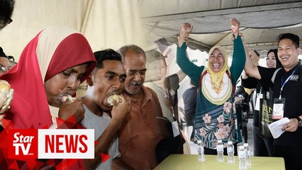 Teacher wins durian eating contest