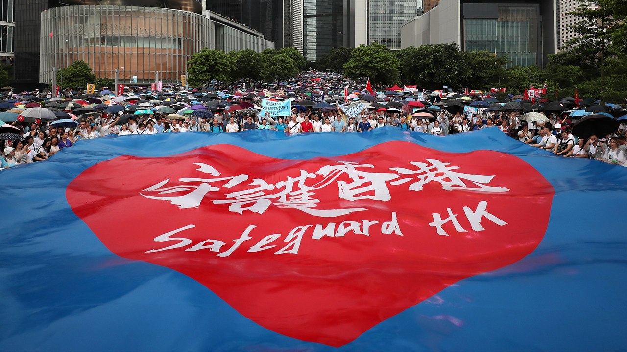 Tens of thousands rally to support Hong Kong police, who earlier foiled the city’s ‘largest-ever’ bomb plot