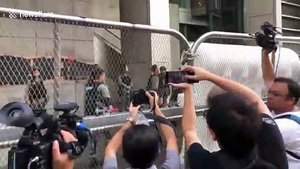 Hong Kong police erect barricades outside HQ as a major protest is held