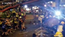 Hong Kong police fire tear gas as protesters approach police lines