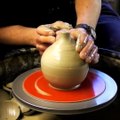 A ceramic clay pottery Apple on the wheel