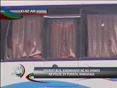 Sacked cop takes tourists hostage