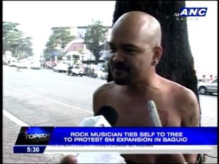 Dong Abay ties self to tree to protest SM project_0000000000000-0000013879979