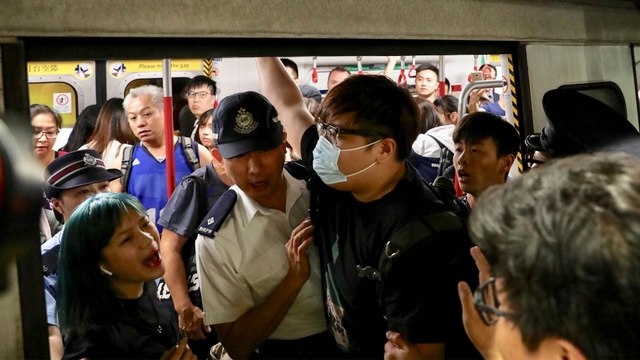 Extradition bill protesters cause rush hour chaos in Hong Kong by blocking main MTR rail line