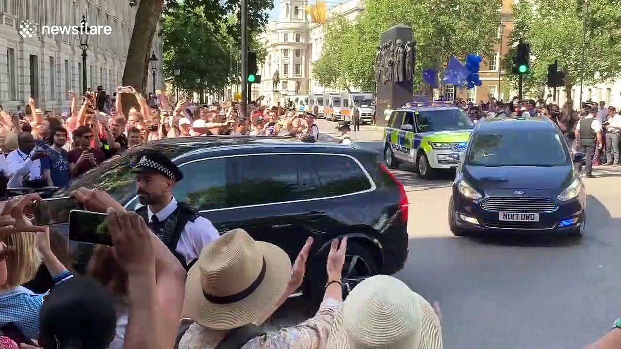 Boris Johnson greeted by a mix of cheers and jeers at Downing Street after being announced as Prime Minister