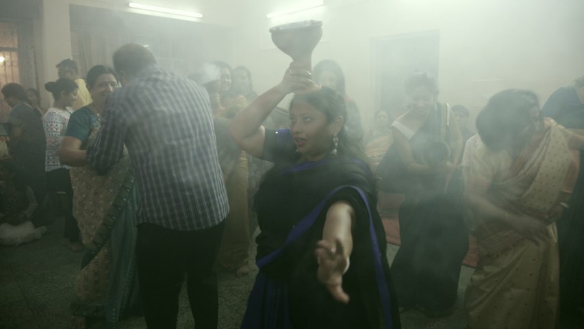 Dancing to the beats of a dhak with a Dhunuchi