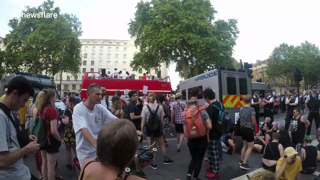 Police cars vandalised as they hold out against anti-Boris Johnson protest in London