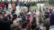 Paraguayans don frightening feather costumes for celebration