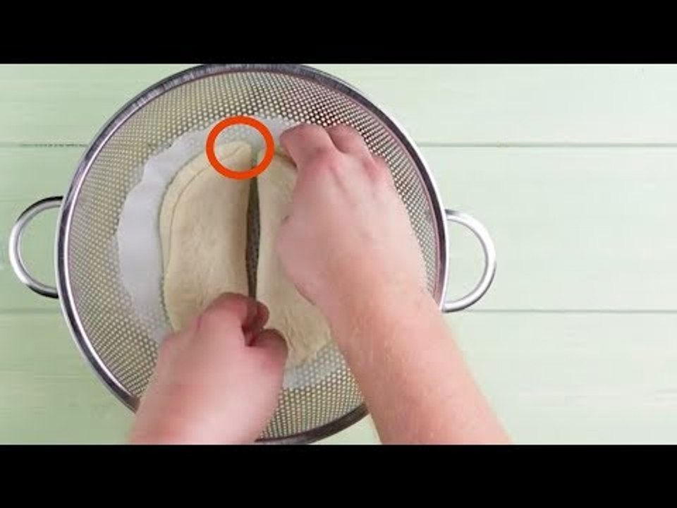 Put Dough On Parchment Paper In A Sieve. Sounds Weird, But It's Worth It!