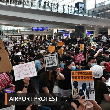 Hong Kong protesters rally at airport to 'educate' visitors