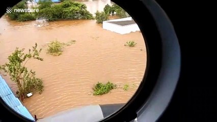 Terrifying footage of helicopter rescue of nine people from floodwaters in India