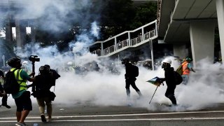Police fire tear gas at Hong Kongers defying ban on anti triad rally