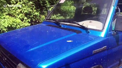 Filipino locals choose between fording a river in their cars or crossing a rickety wooden bridge