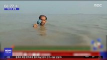 [이시각 세계] '목까지 물 찼지만'…파키스탄 열혈 기자 화제