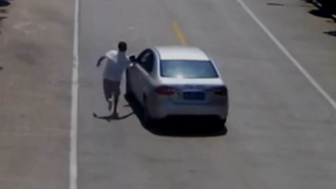Taxi Driver Stops Driverless Car Rolling Down Road