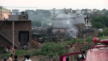 Pakistani army plane crashes into residential area