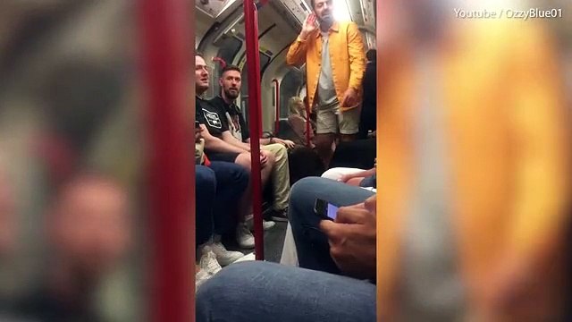 Moment 'drunken' chanting Chelsea fan shoved off London tube