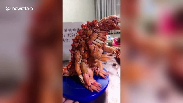 Creative man in China uses crayfish shells to build dinosaur-like sculptures