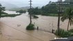 Flood waters pour over river channels after vigorous downpours
