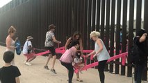 Watch: Mexican and American children play across border wall on pink seesaws