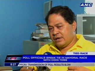 Poll officials break tie in mayoral race with coin toss