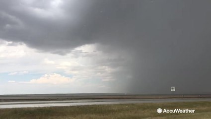 Powerful storm threatens to flood highway