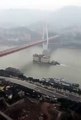 Five-storey building caught floating across China river in viral video