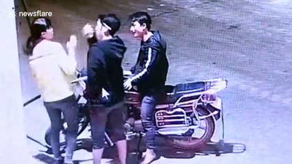 Alleged drunk man sets his own motorbike on fire at petrol station in China