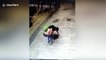 Chinese dad rescues son after he falls through broken manhole cover