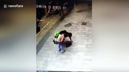 Chinese dad rescues son after he falls through broken manhole cover