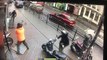 This shocking footage shows a salon worker fighting off a gang of moped riders with a shop sign - as they tried to smash into a jewellery shop with sledgehammers