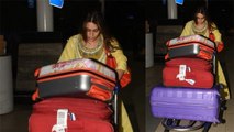 Sara Ali Khan carries her luggage at Mumbai airport; Check Out | FilmiBeat