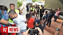 10 Nigerians charged with rioting, attacking cops at Flora Damansara