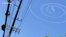 Jet impressively draws perfect spiral in skies over Los Angeles