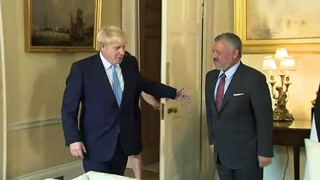 Boris Johnson greets Jordan's King Abdullah II