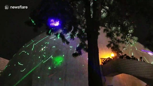 Hong Kong protesters create their own light show after student was arrested for buying laser pens