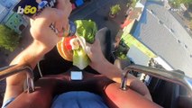 Social Media Influencer Tries To Assemble Burger On Thrill Ride That Drops You 100 Feet!