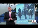 Dos policías blancos a caballo llevan a un hombre negro esposado | Noticias con Francisco ZE